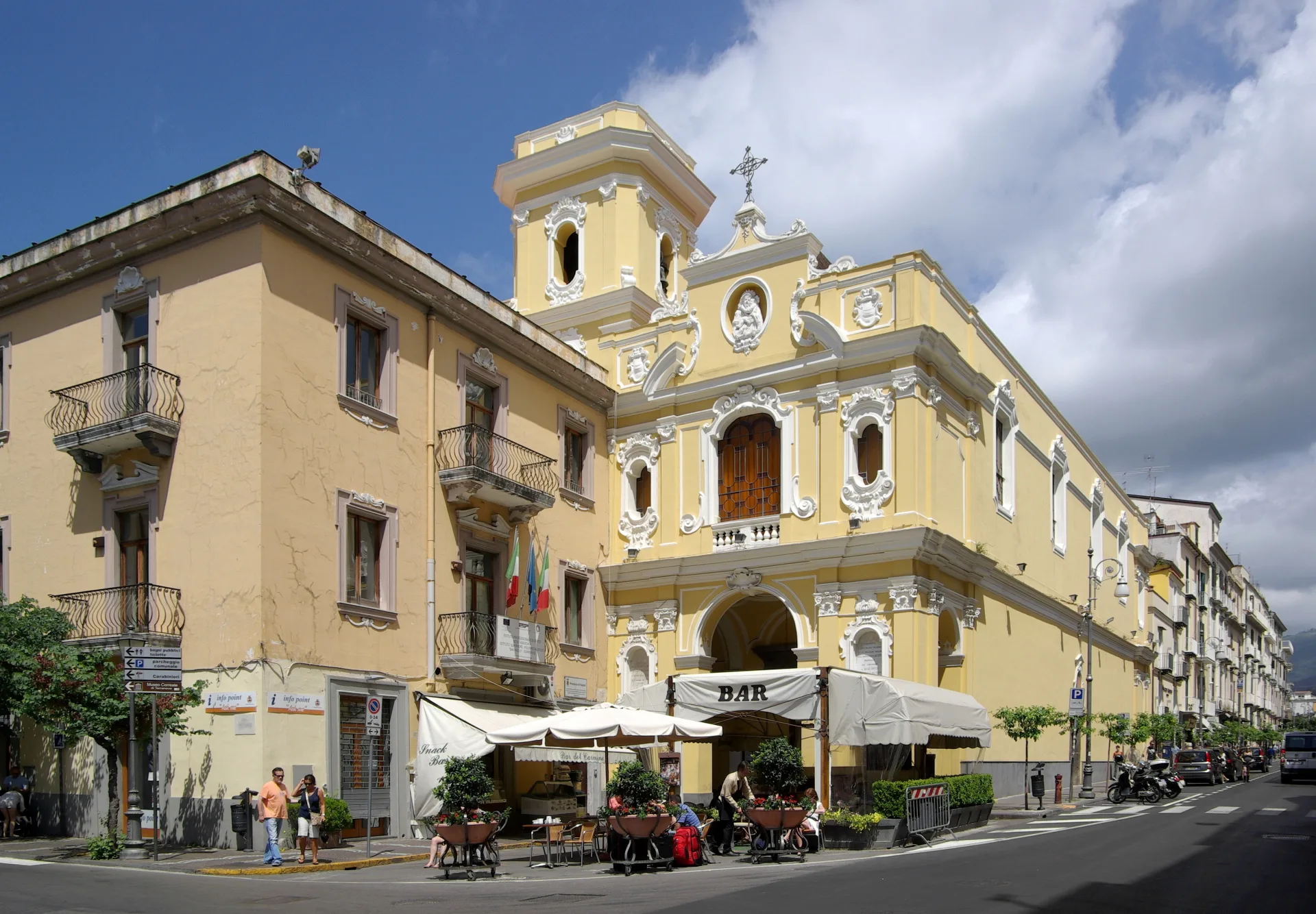 The yellow façade and bell tower of the Church of the Carmine, overlooking Piazza Tasso