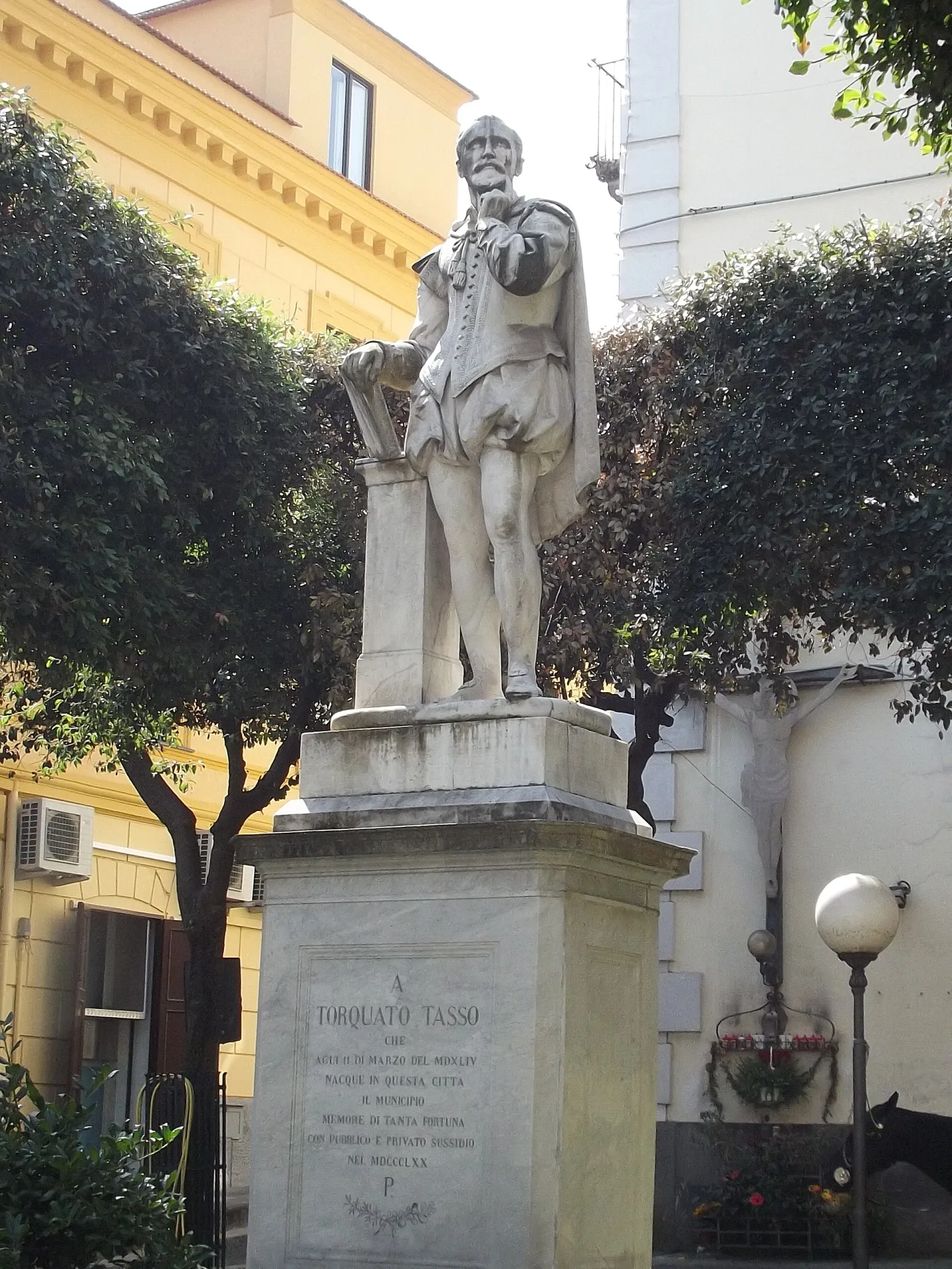 The statue of Torquato Tasso at the corner of Piazza Tasso where Via Pietà begins