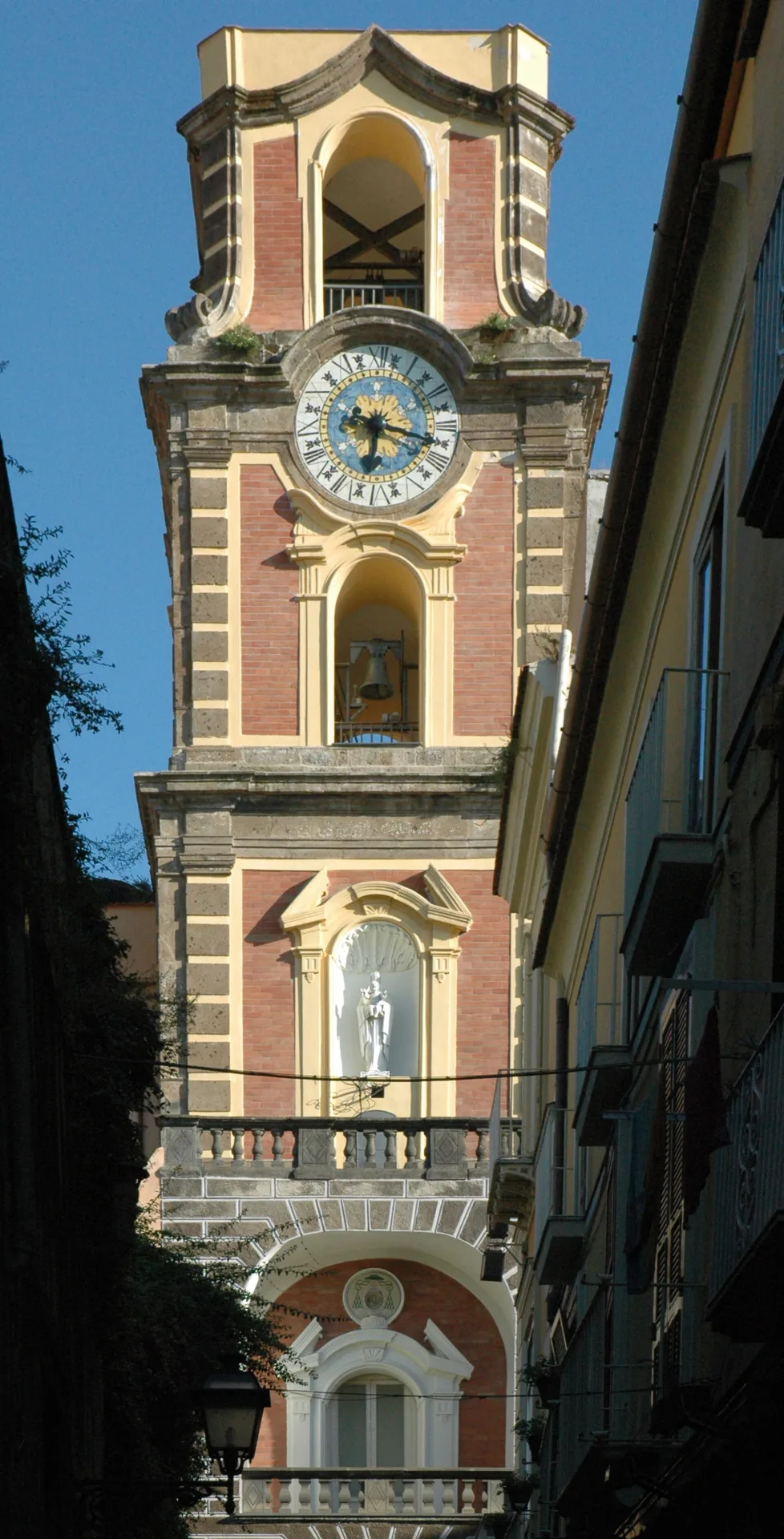 The Cathedral bell tower, where Via Pietà ends, with its majolica clock